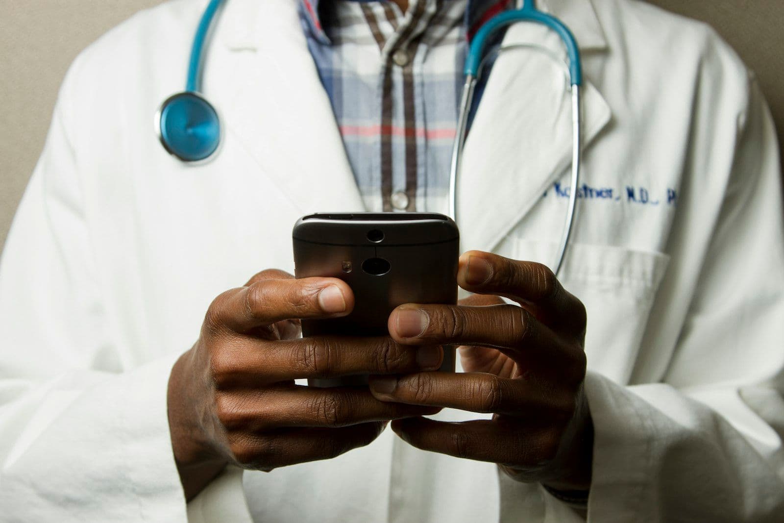 Doctor reviewing medical records on a tablet